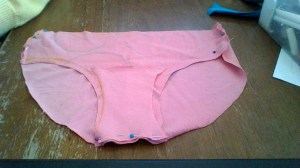 Although this picture shows the lining pinned to the wrong side of the front, I realized that it should actually be pinned to the back