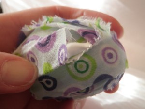 Glue down the end of the fabric.