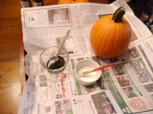 My set up. I found it really helpful to have a few layers of paper to help me manage the sparkle mess. I learned later that a wide bowl holding the sparkles made the job much easier.