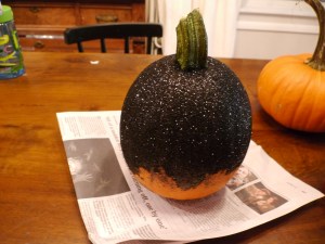I let the glue dry and moved on to another pumpkin to keep the momentum going. This is when the multiple layers of newspaper on my work surface came in handy.